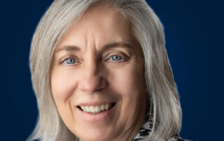 Kim Faircloth, ICF-certified coach and author, smiling in professional headshot photo